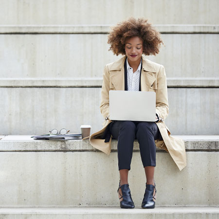 Woman sitting with a laptop