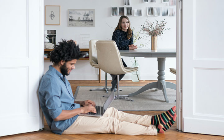 Two men having in a meeting by a laptop